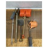 Spade, snow shovel, water can and post hole