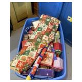Tote full of Christmas boxes and gift bags with