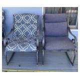 Two patio rocking chairs with some spots of