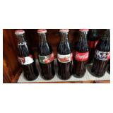 15 sealed bottles of Coca-Cola