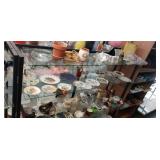 Contents of shelf. Clay Planters dishes,