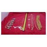 Necklaces mostly gold tone and white