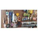 Hardware on peg board flashlights, bobbers,