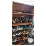 All contents on shelf flatware, lids for pots and