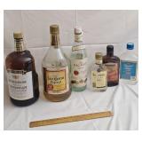 Partially opened bottles of alcohol
