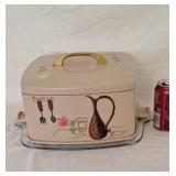 Vintage mid-century Ransburgcake holder, tin top