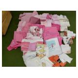 Bath, wash clothes ,towels mostly pink, kitchen