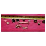 Tic tacks, cuff links, rhinestones