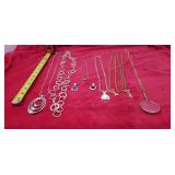 God tone ,silver tone necklaces magnifying glass