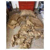 Approximately 35 empty gunny sacks