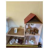 Handmade older wooden doll house with some doll