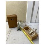Microscope, old bottles and wood crate