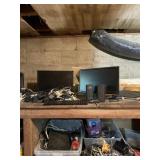 Computer monitors, speakers and lots of plugs and