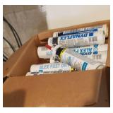 Shelf w approx 23 tubes of caulk silicone,  nails