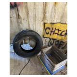 All Season P 215/75 R15 tire and wood crate