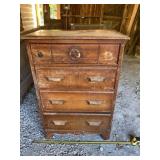 Old dresser missing a handle and has signs of