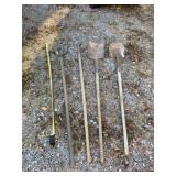 Two pitch forks and shovels