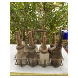 Old oil jars and steel holder