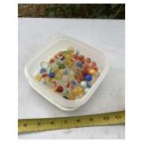 Container of marbles with lid