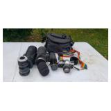 Olympus camera w 2 extra lens stored in shed