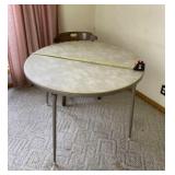 Round card table with wooden chair