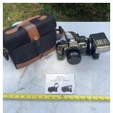 Deluxe Olympic camera with case  and owners