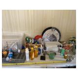 Tote with lid full of bathroom supplies, candle