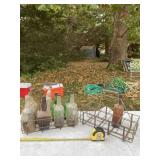 Old bottles and steel carrying racks