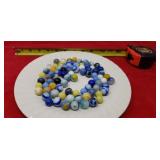 Collectible blue , yellow solid, swirl marbles