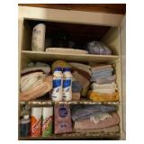 Contents of bath closet including towels, wash