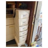 Seven small stackable totes with contents