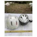 Two bicycle helmets