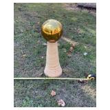 Gold gazing ball on stand as one unit