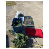 Totes with lids containing Christmas lights,