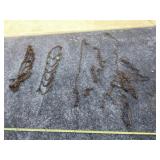 Two lawnmower tire chains and chain pieces