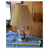 Glass lamp with silk flower arrangement