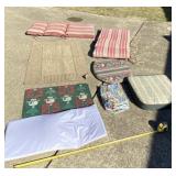 Two patio chair cushions, rugs , table cloth and