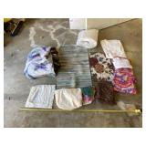 Rugs, comforter, blanket, pillowcase and towels