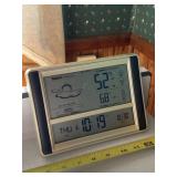 Hanging Acu Rite forecast and temperature display