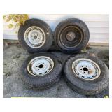 Four Goodyear Wrangler LT225/75R16 tires on 2400