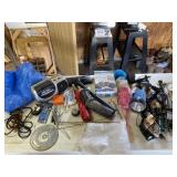 Contents on table including tarp, radio and