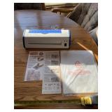 Crofton laminating machine with laminating sheets