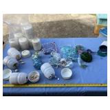Colored pebbles and craft supplies in plastic