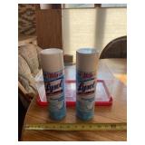 Two full cans of Lysol and plastic tote with lid