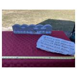 Grave concrete sign with some breakage and