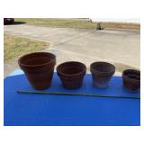 Four clay plant/flower pots