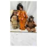 Native American-themed porcelain dolls.