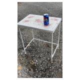 white mosaic tile-top side table with a floral