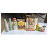 Old advertising tin cans and pop bottles