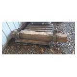 Antique bolster with iron brackets.